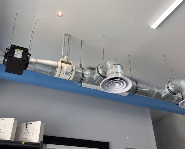 Air extraction ducts across the ceiling